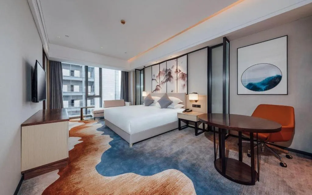 Bed in New Century Grand Hotel Ningbo Zhongdu