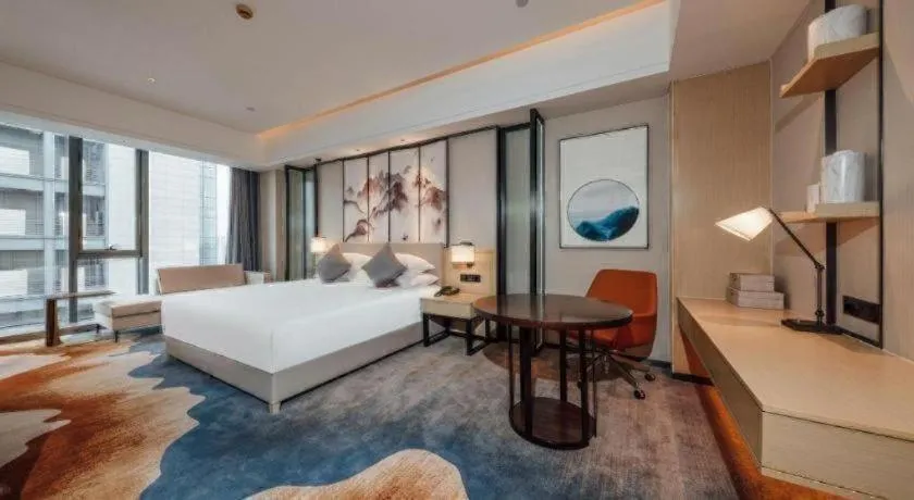 Bed in New Century Grand Hotel Ningbo Zhongdu