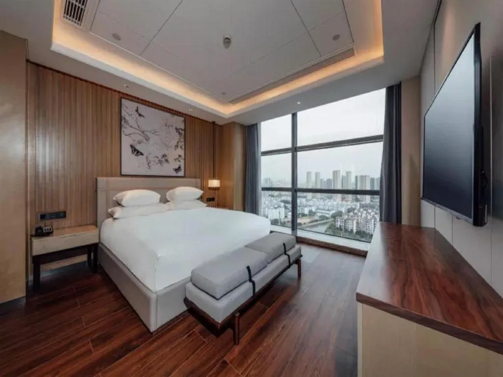 Bed in New Century Grand Hotel Ningbo Zhongdu
