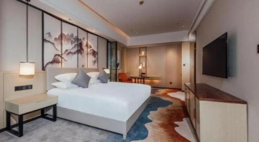 Bed in New Century Grand Hotel Ningbo Zhongdu