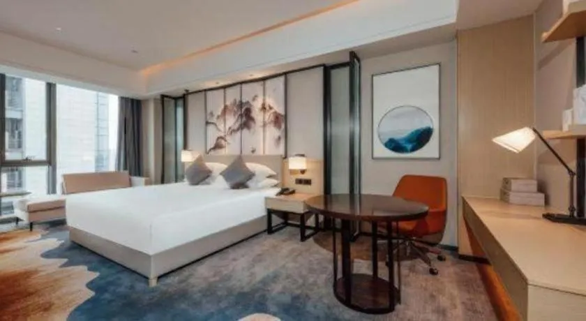 Bed in New Century Grand Hotel Ningbo Zhongdu