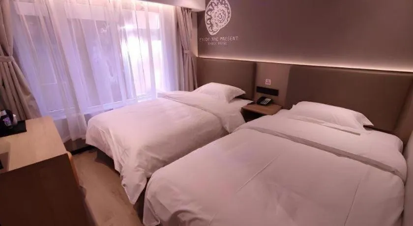 Bed in Shell Hotel Beijing Shunyi District Shunyi Metro Station