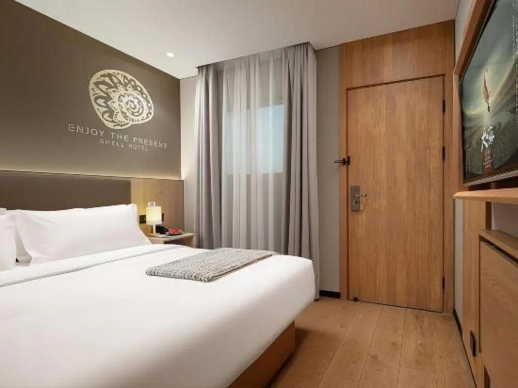 Bed in Shell Hotel Beijing Shunyi District Shunyi Metro Station