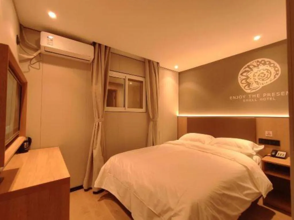 Bed in Shell Hotel Beijing Shunyi District Shunyi Metro Station