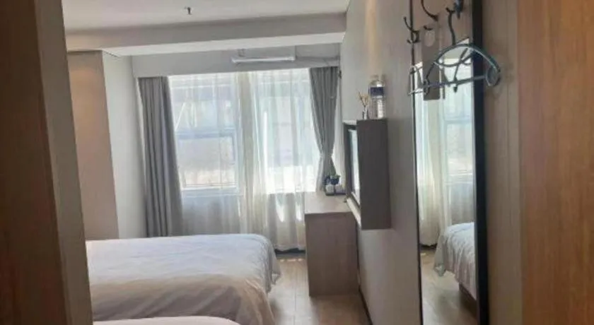 Bed in Shell Hotel Beijing Shunyi District Shunyi Metro Station