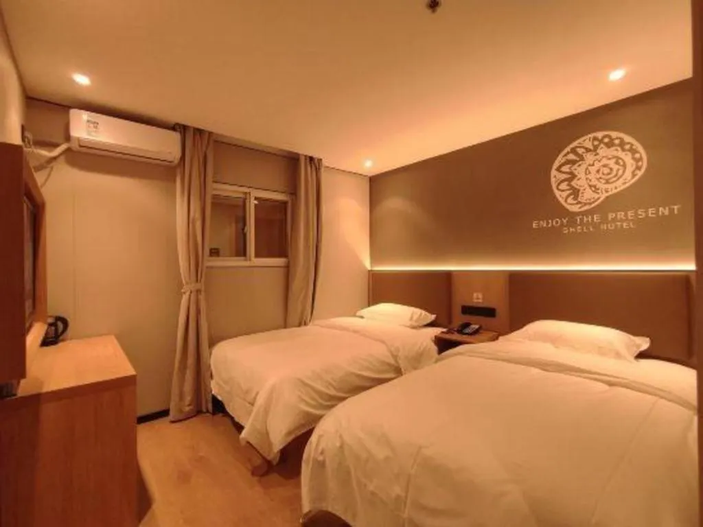 Bed in Shell Hotel Beijing Shunyi District Shunyi Metro Station
