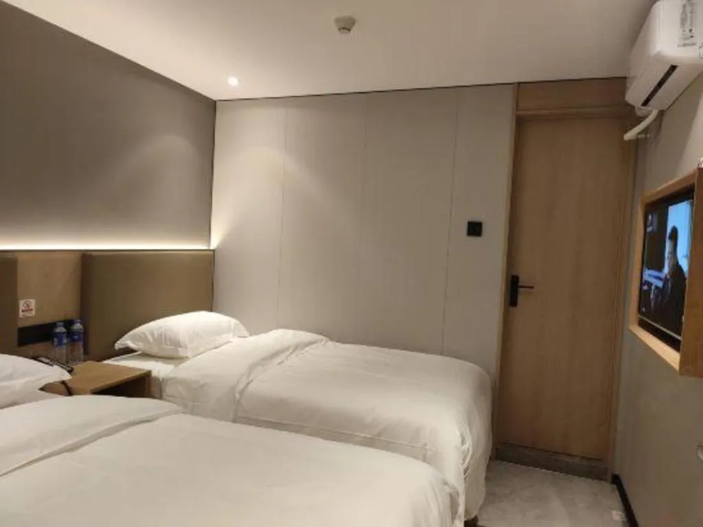 Bed in Shell Hotel Beijing Shunyi District Shunyi Metro Station