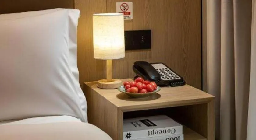 Bed in Shell Hotel Beijing Shunyi District Shunyi Metro Station