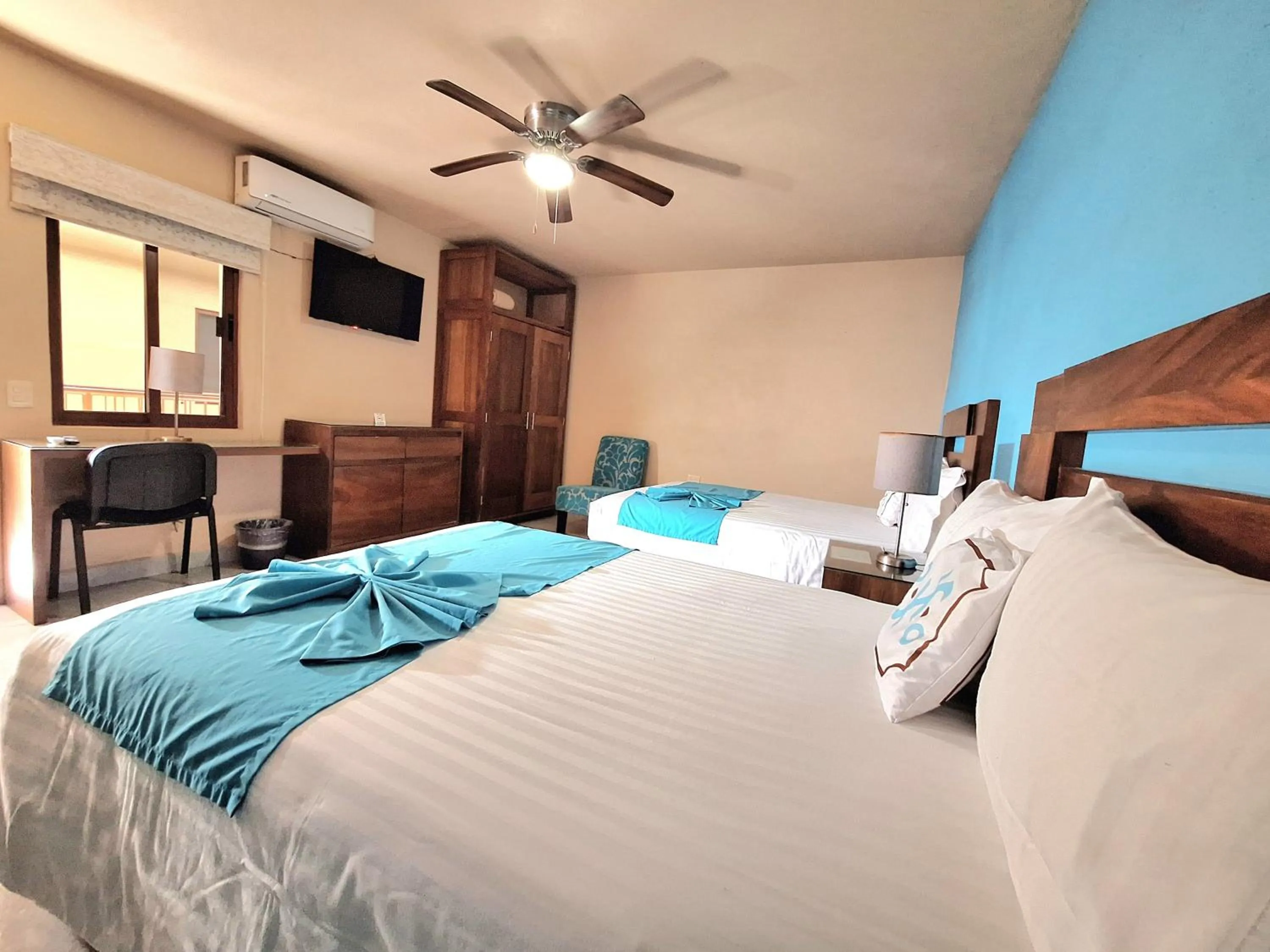 Bed in Pacific Inn hotel