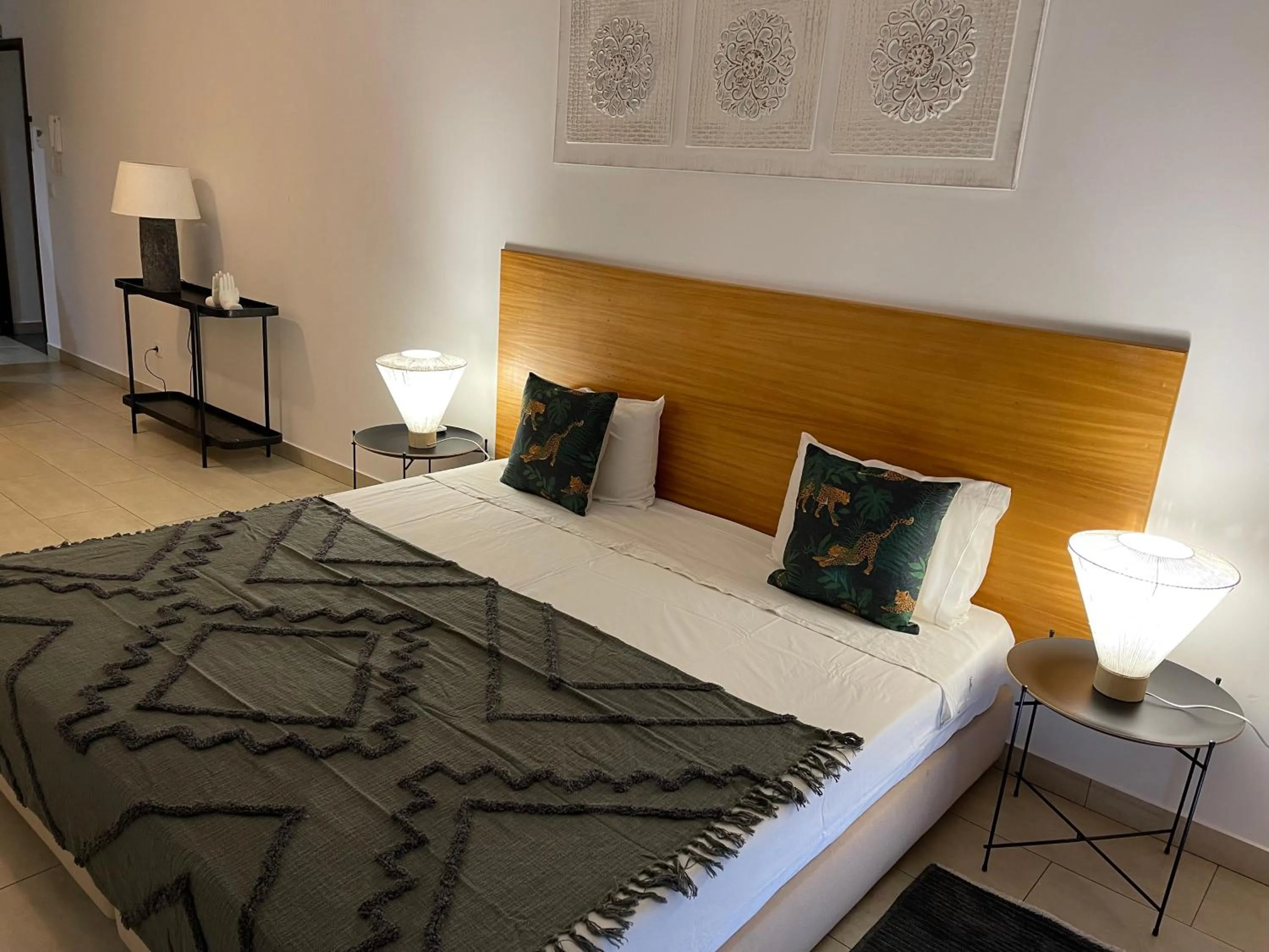 Bed in Esmeralda Holidays Apartments