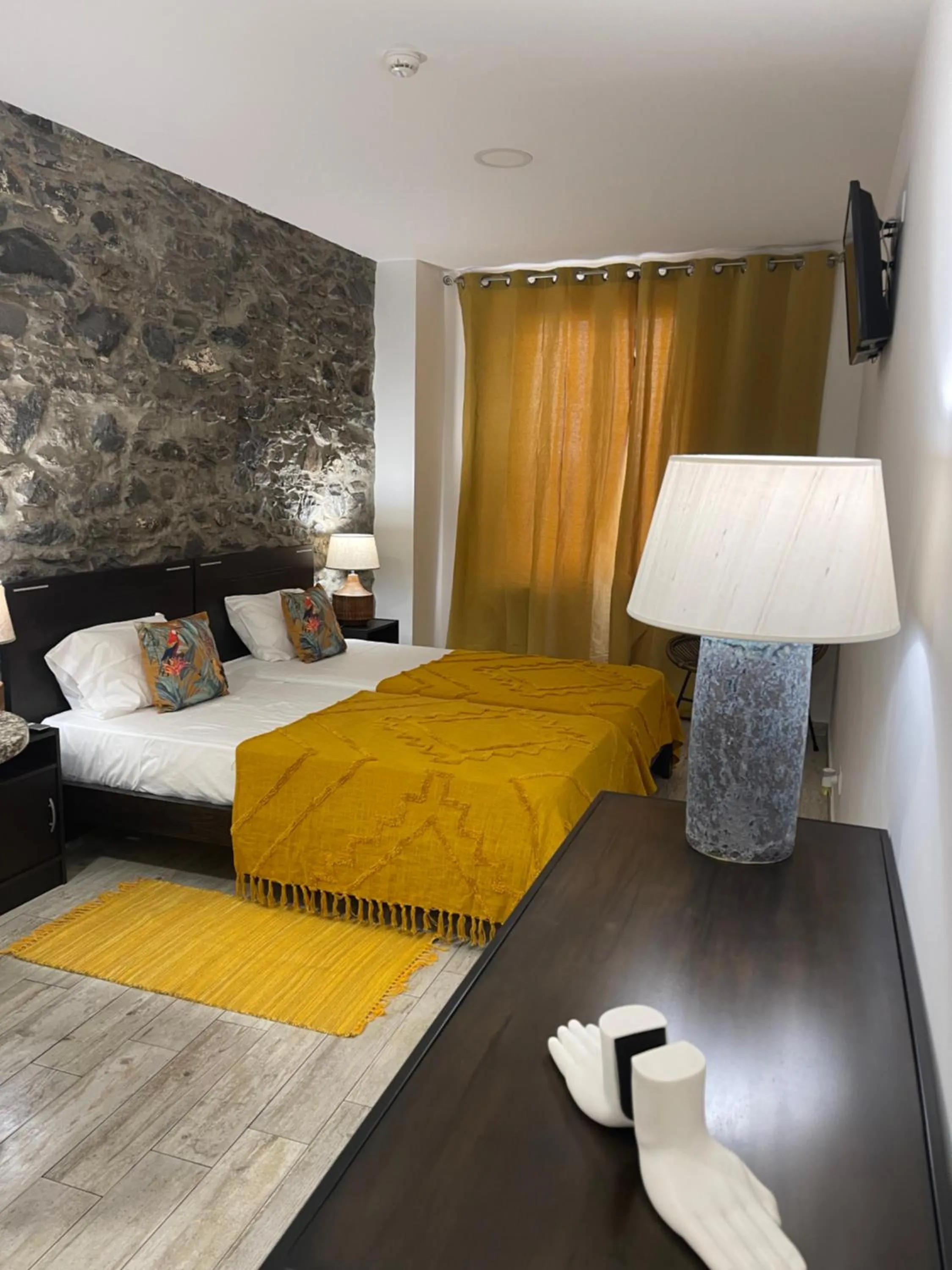 Bed in Esmeralda Holidays Apartments