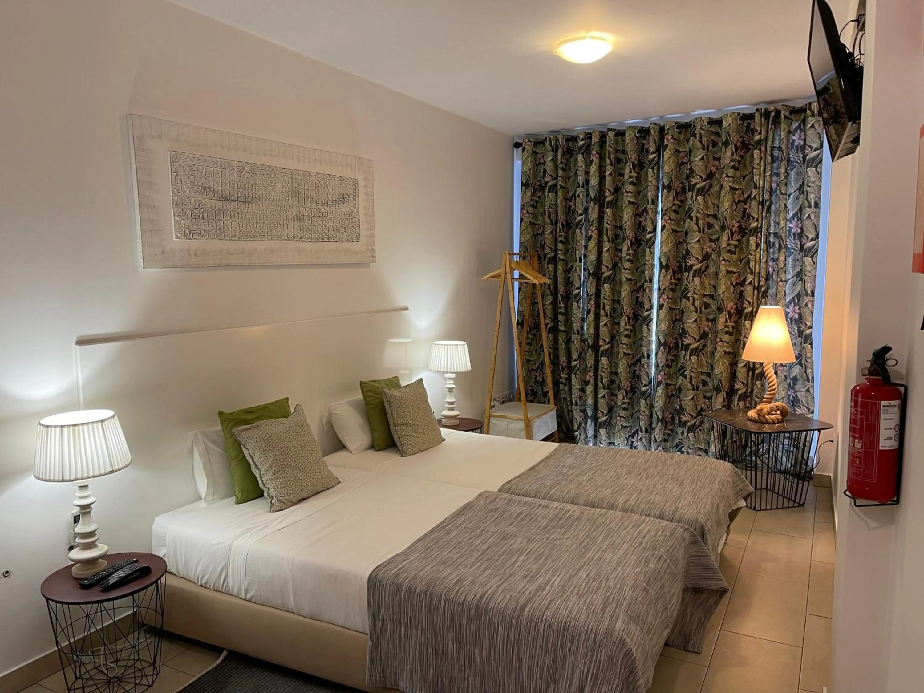 Bed in Esmeralda Holidays Apartments