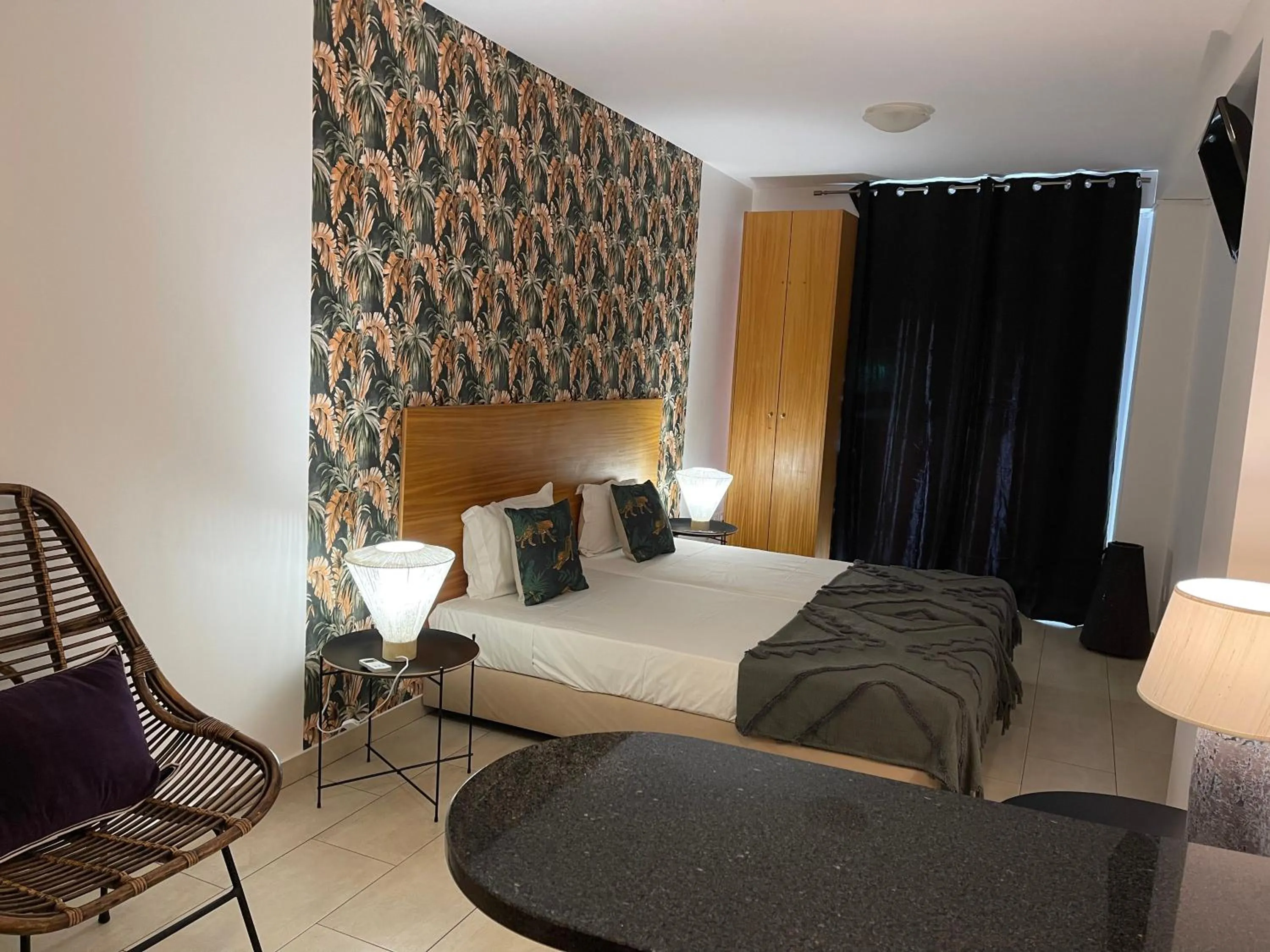 Bed in Esmeralda Holidays Apartments