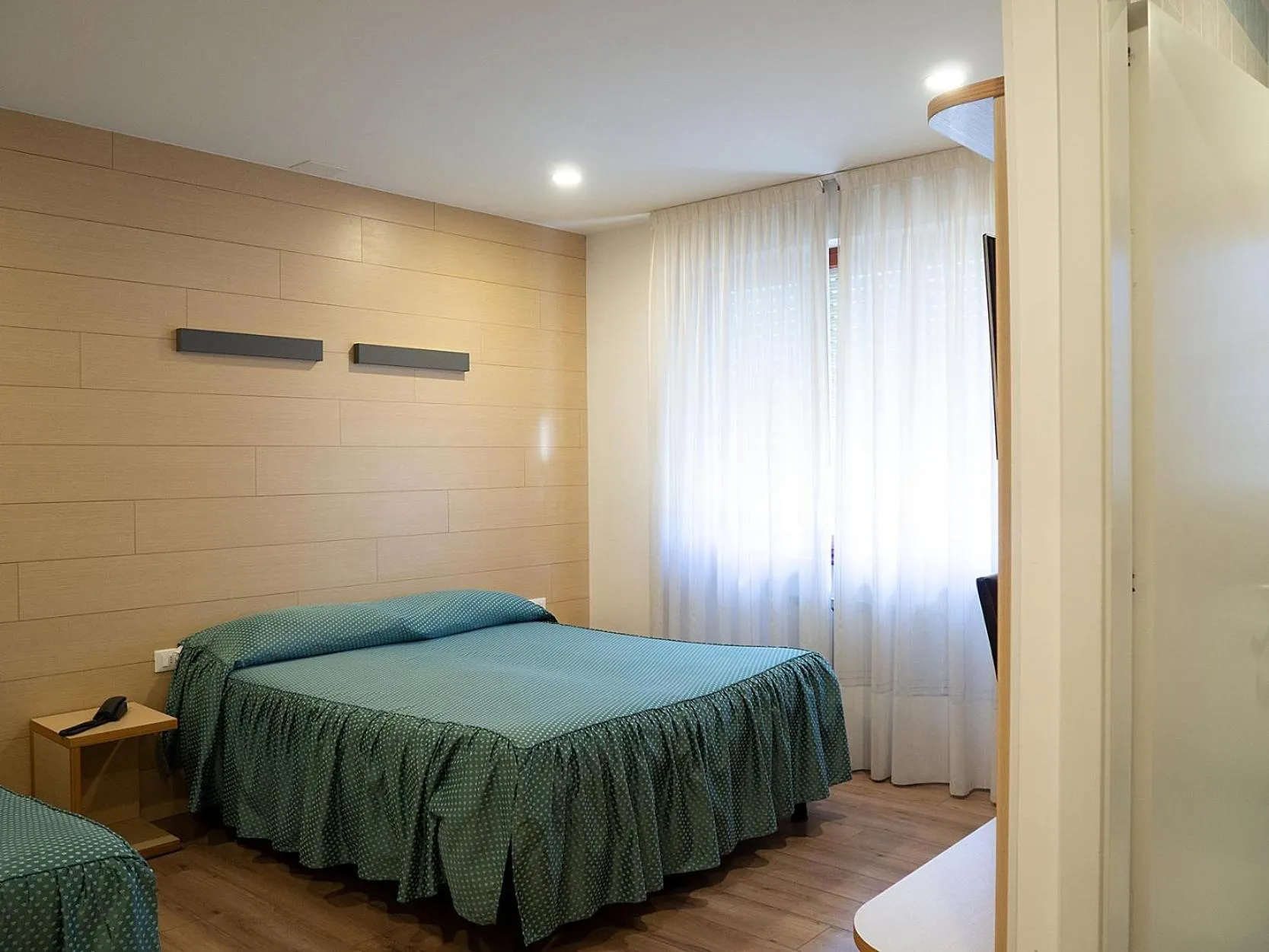 Bed in Al Benvenuto Hotel & Restaurant