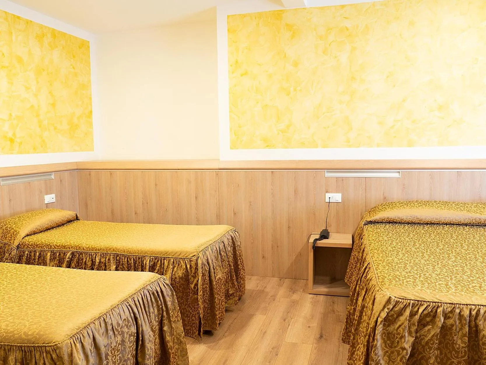 Bed in Al Benvenuto Hotel & Restaurant