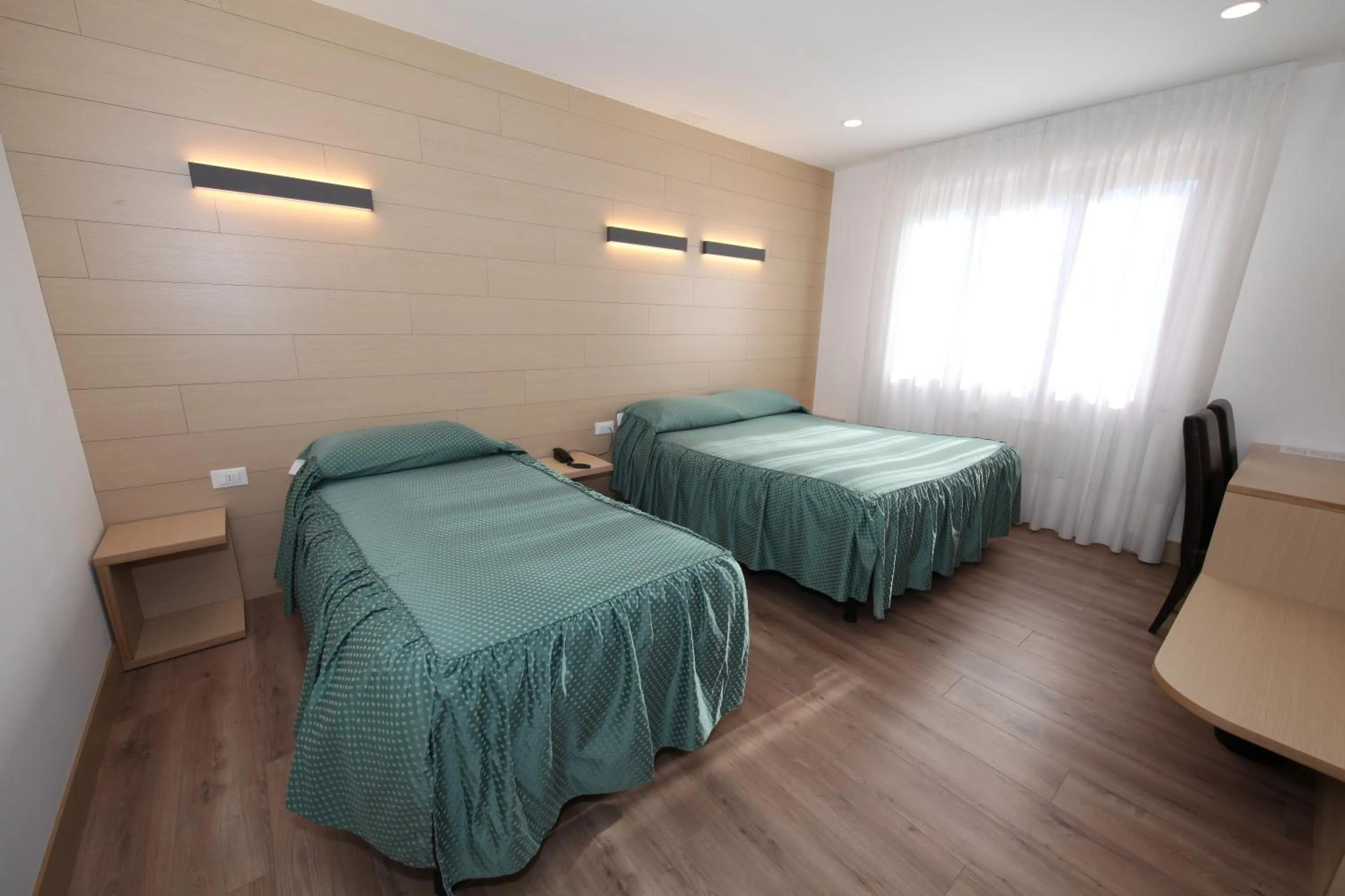 Bed in Al Benvenuto Hotel & Restaurant