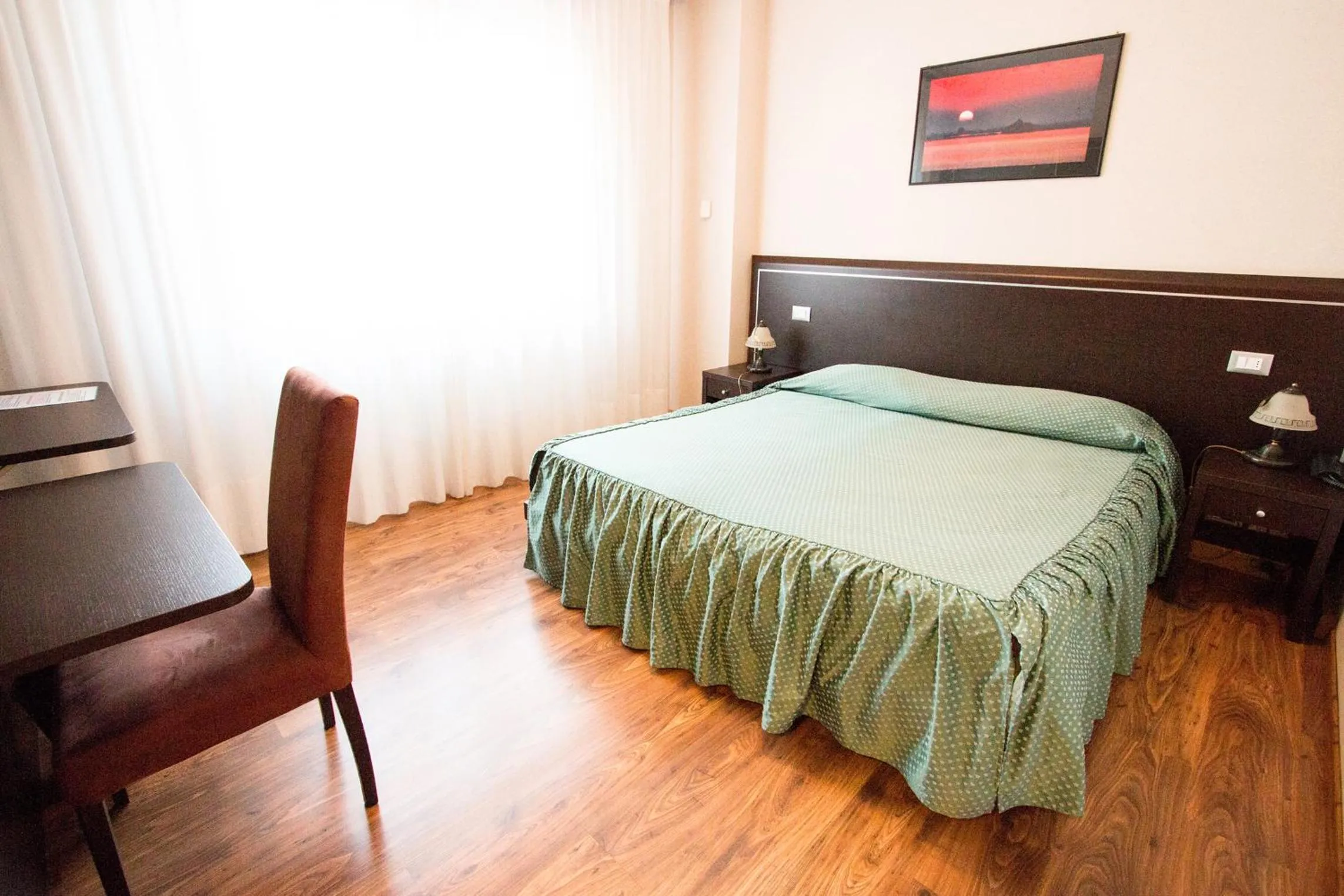 Bed in Al Benvenuto Hotel & Restaurant