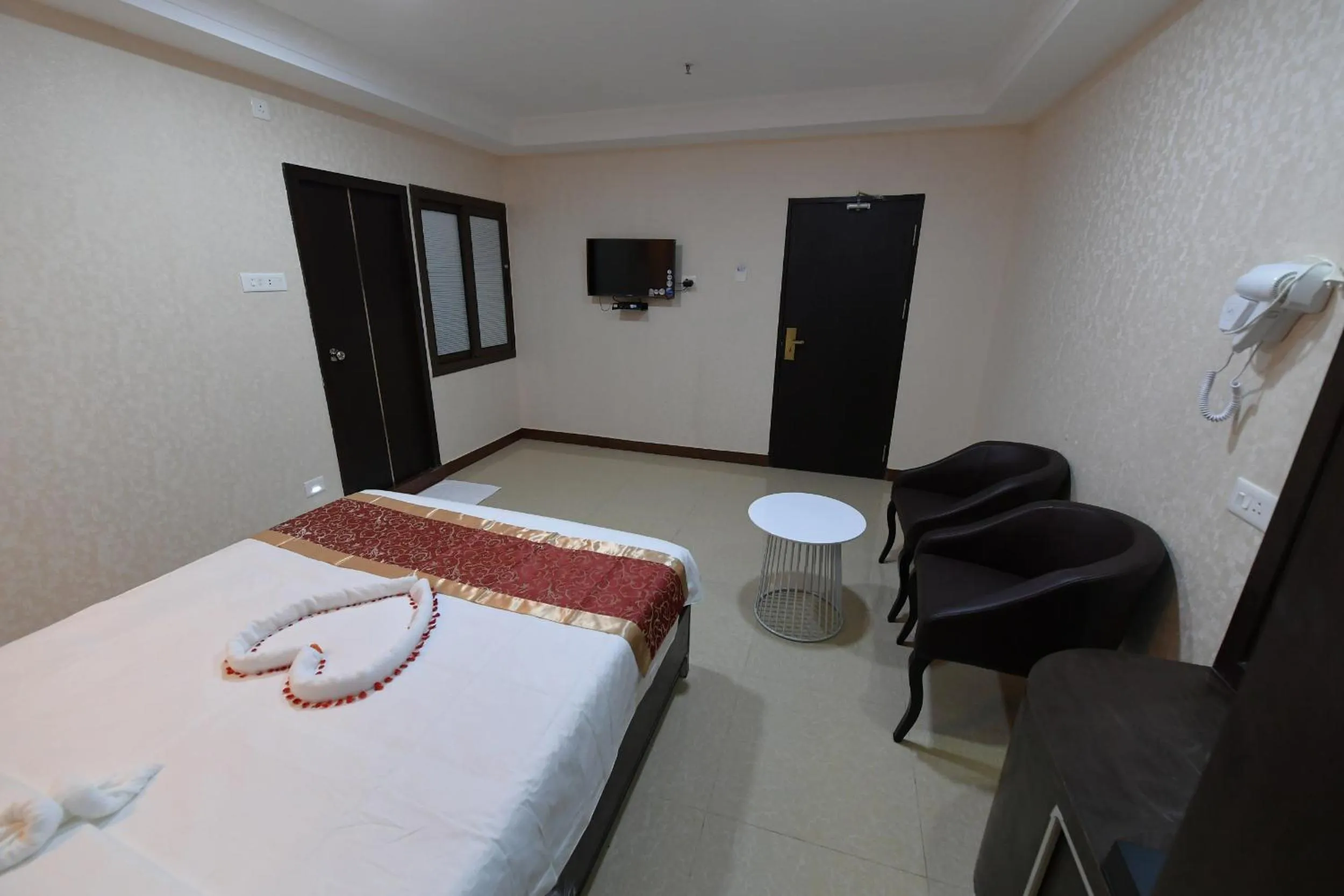 Bed in Coastal Grand Hotel Sampath