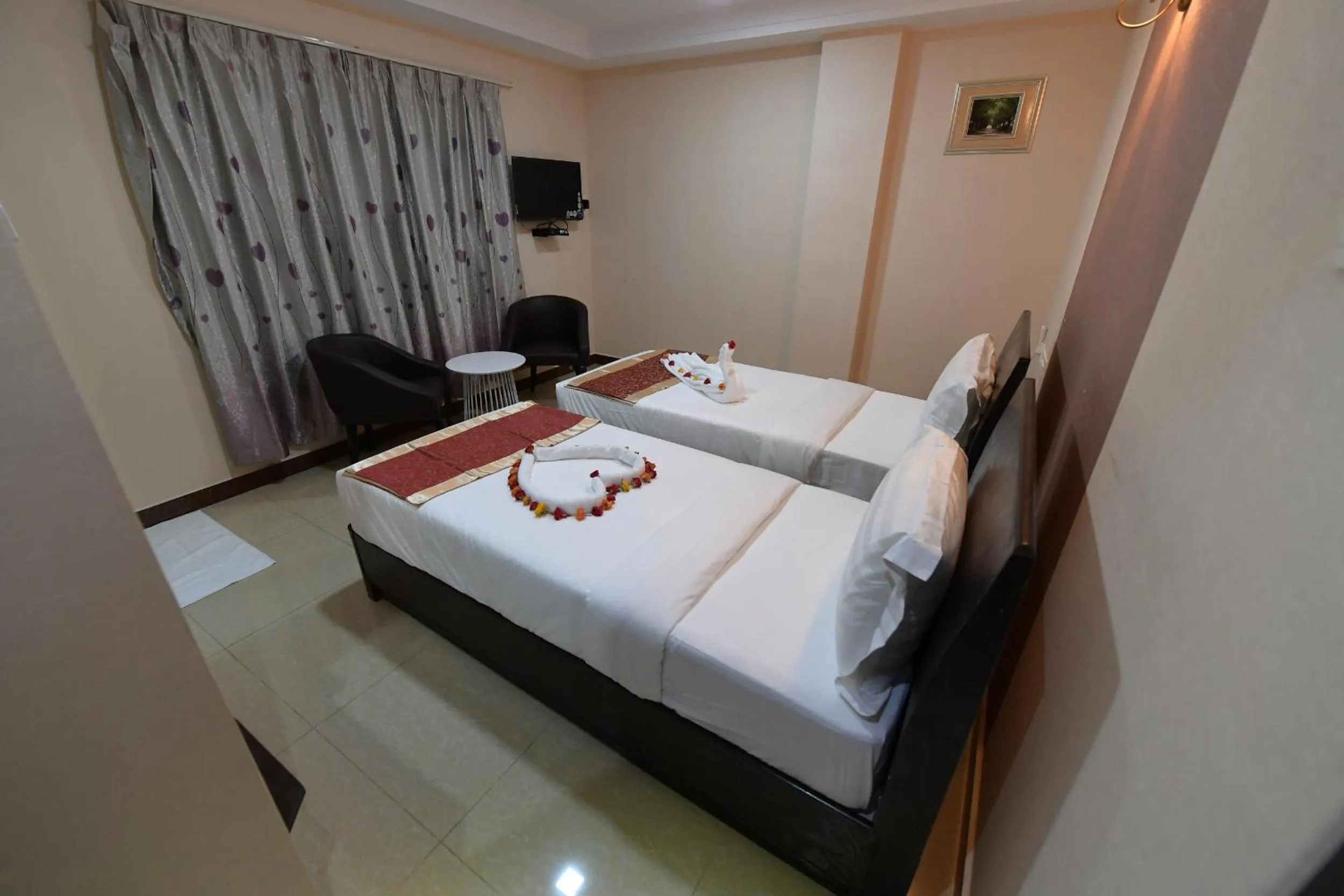 Bed in Coastal Grand Hotel Sampath