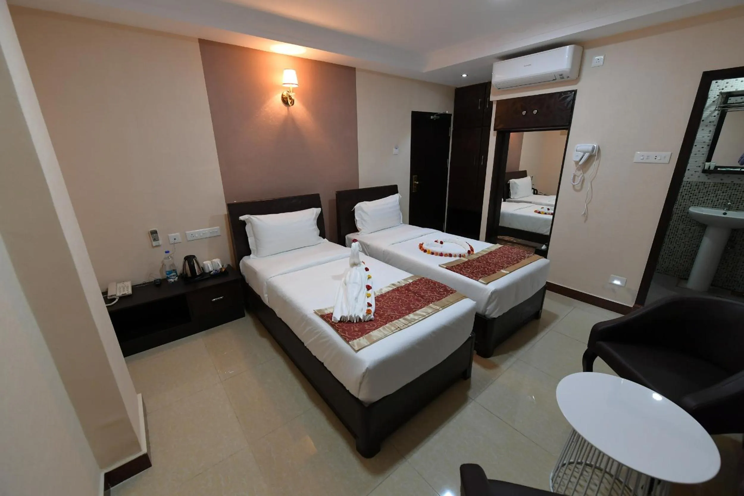 Bed in Coastal Grand Hotel Sampath