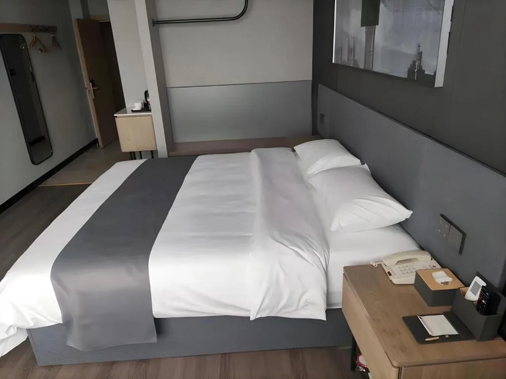 Bed in Thank Hotel Shandong Linyii Pingyi County Commerce and Trade City