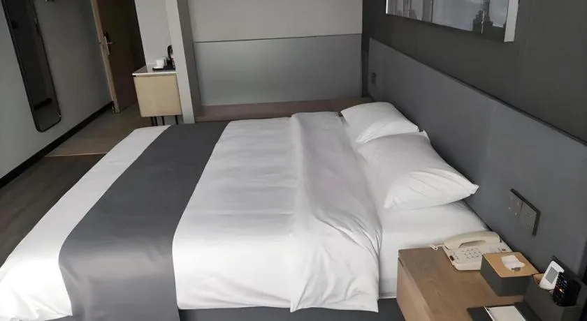 Bed in Thank Hotel Shandong Linyii Pingyi County Commerce and Trade City