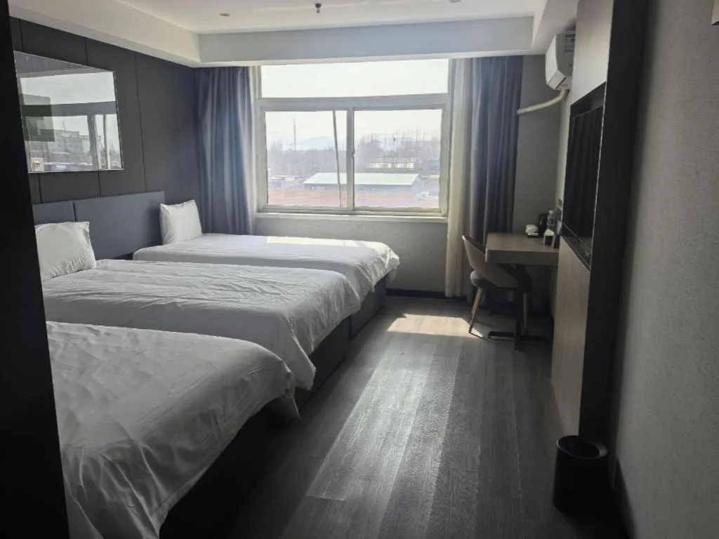 Bed in Thank Hotel Shandong Linyii Pingyi County Commerce and Trade City