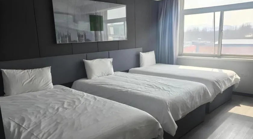Bed in Thank Hotel Shandong Linyii Pingyi County Commerce and Trade City