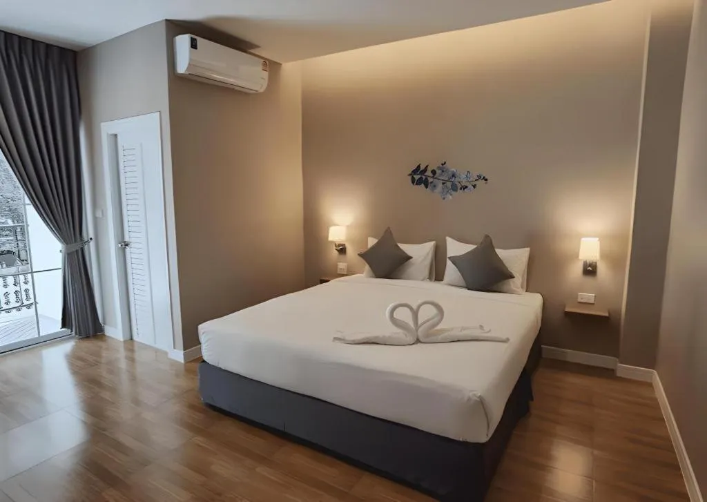 Bed in Thong Prachok Hotel