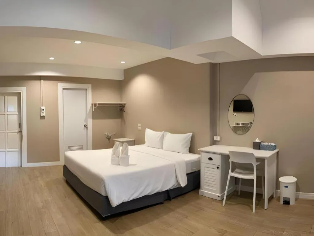 Bed in Thong Prachok Hotel