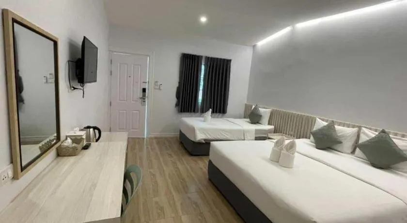 Bed in Thong Prachok Hotel