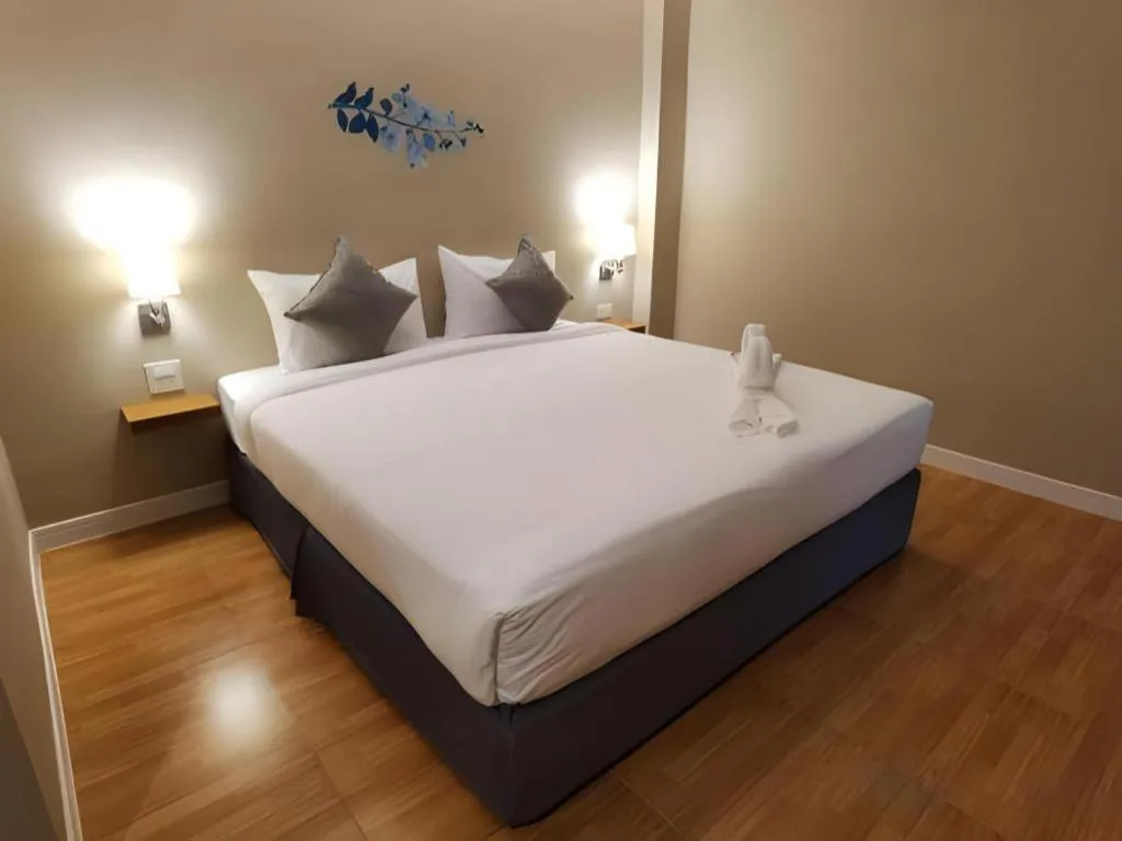 Bed in Thong Prachok Hotel