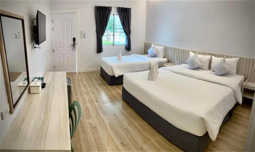 Bed in Thong Prachok Hotel