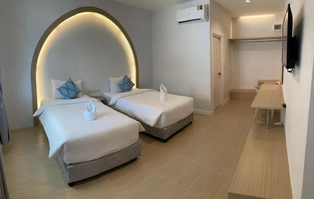 Bed in Thong Prachok Hotel