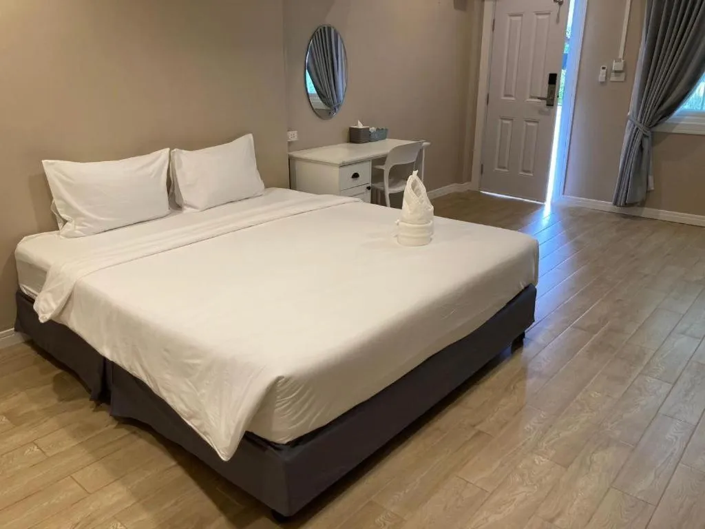 Bed in Thong Prachok Hotel