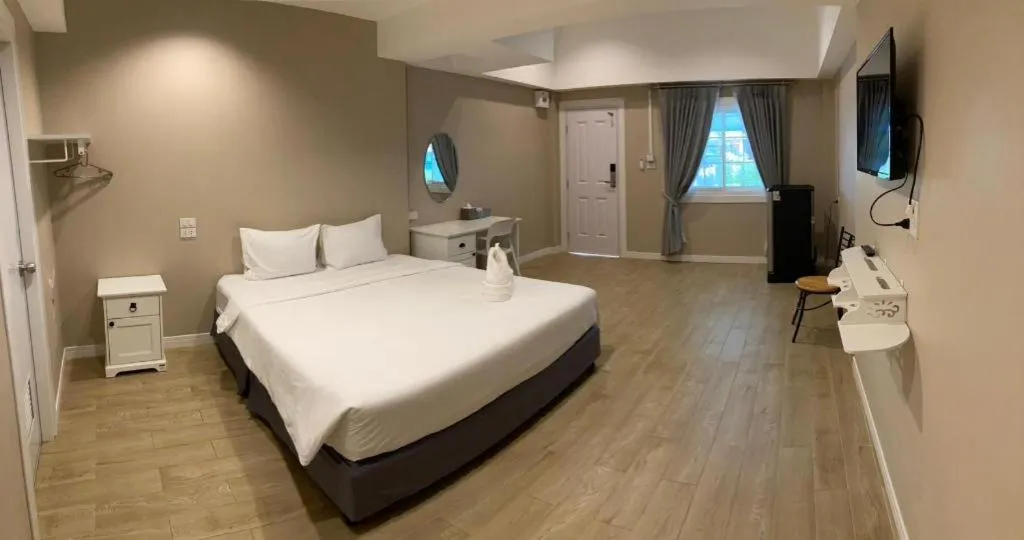 Bed in Thong Prachok Hotel