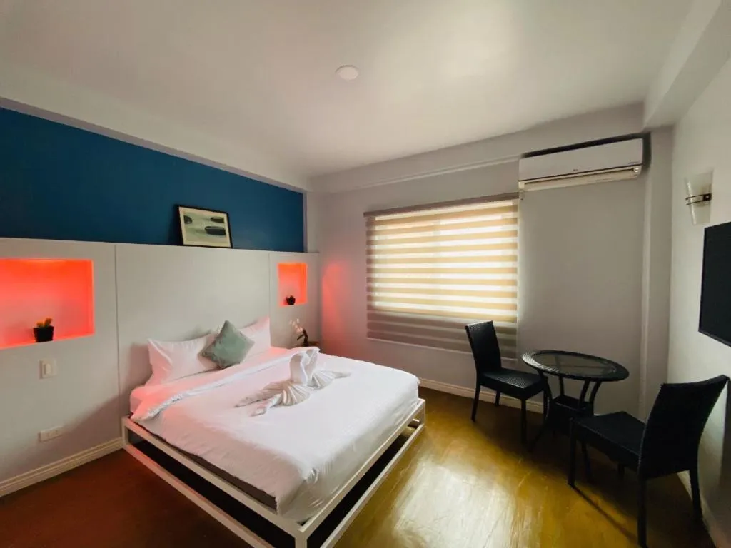 Bed in THE SHORELINE SUBIC HOTEL