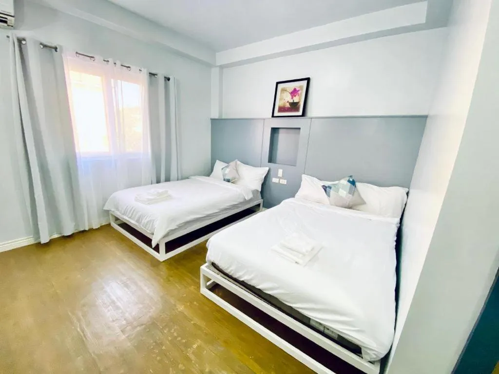 Bed in THE SHORELINE SUBIC HOTEL