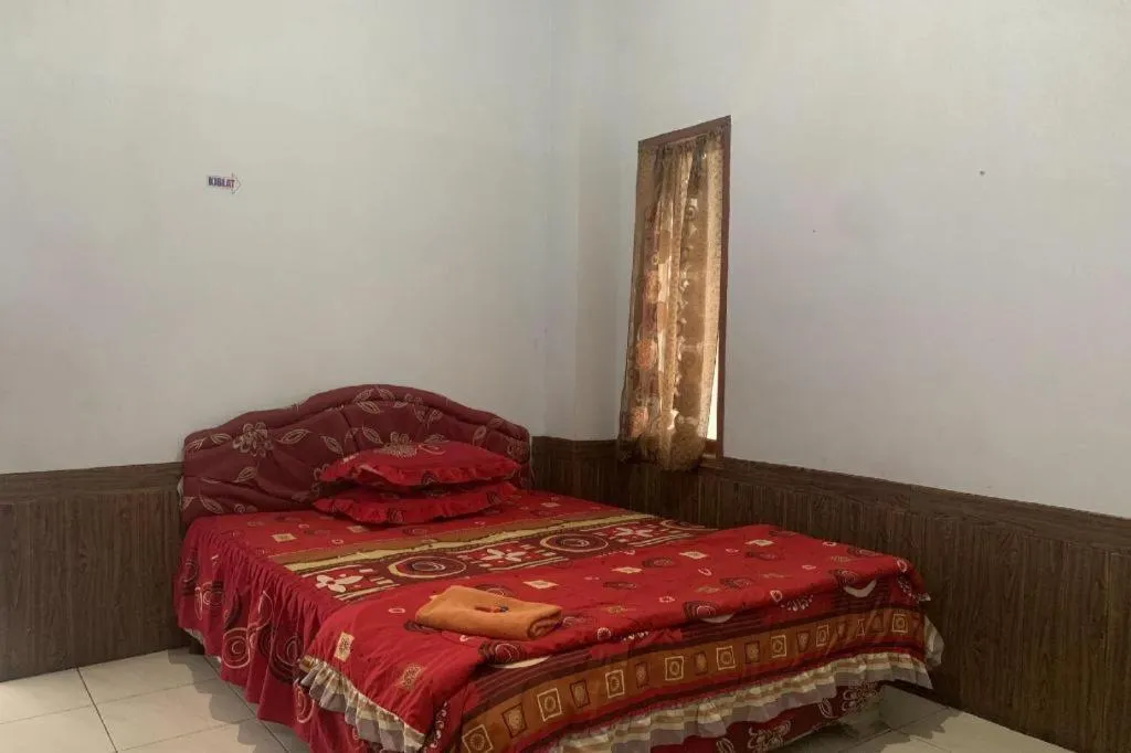 Bed in OYO 91263 Dinar Homestay