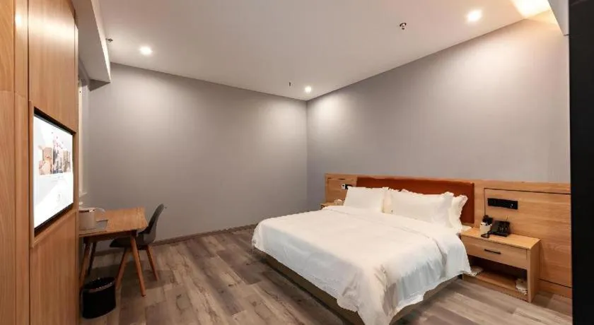 Bed in Borrman Hotel Jiangyin Zhouzhuang