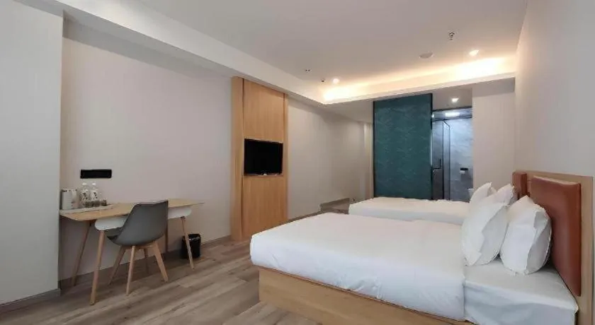 Bed in Borrman Hotel Jiangyin Zhouzhuang