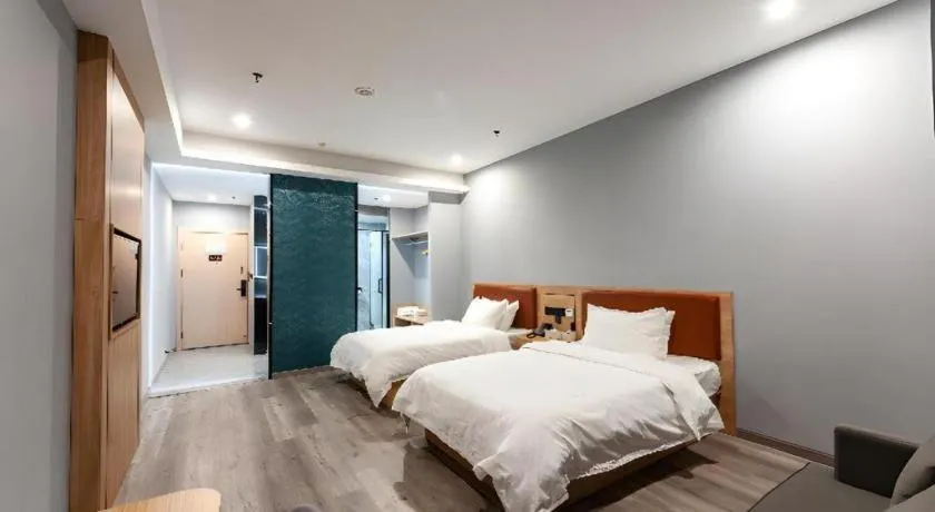 Bed in Borrman Hotel Jiangyin Zhouzhuang