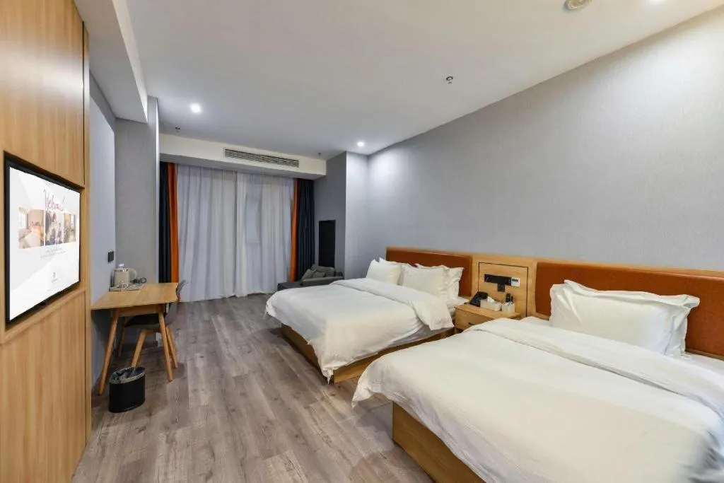 Bed in Borrman Hotel Jiangyin Zhouzhuang