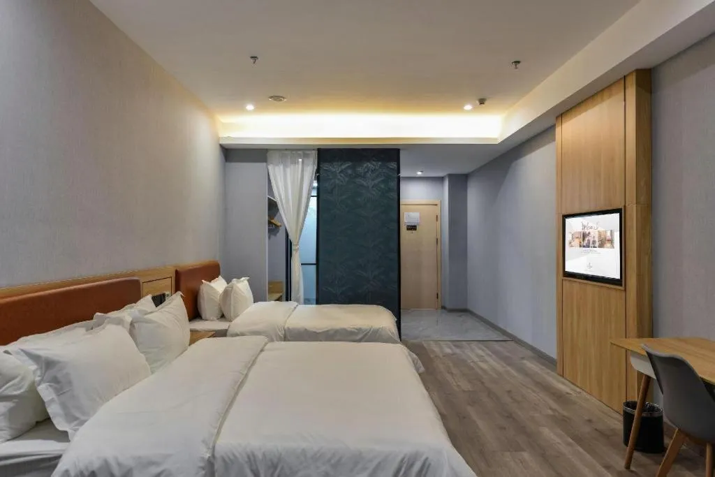 Bed in Borrman Hotel Jiangyin Zhouzhuang