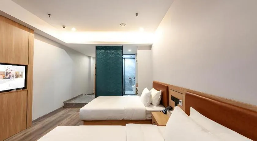 Bed in Borrman Hotel Jiangyin Zhouzhuang