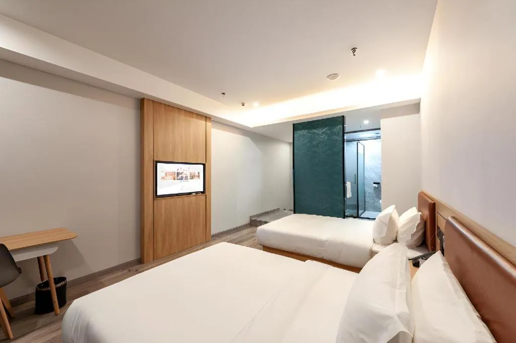 Bed in Borrman Hotel Jiangyin Zhouzhuang