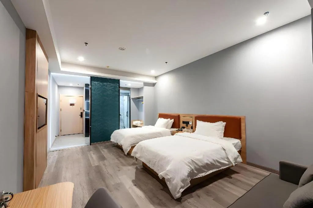 Bed in Borrman Hotel Jiangyin Zhouzhuang