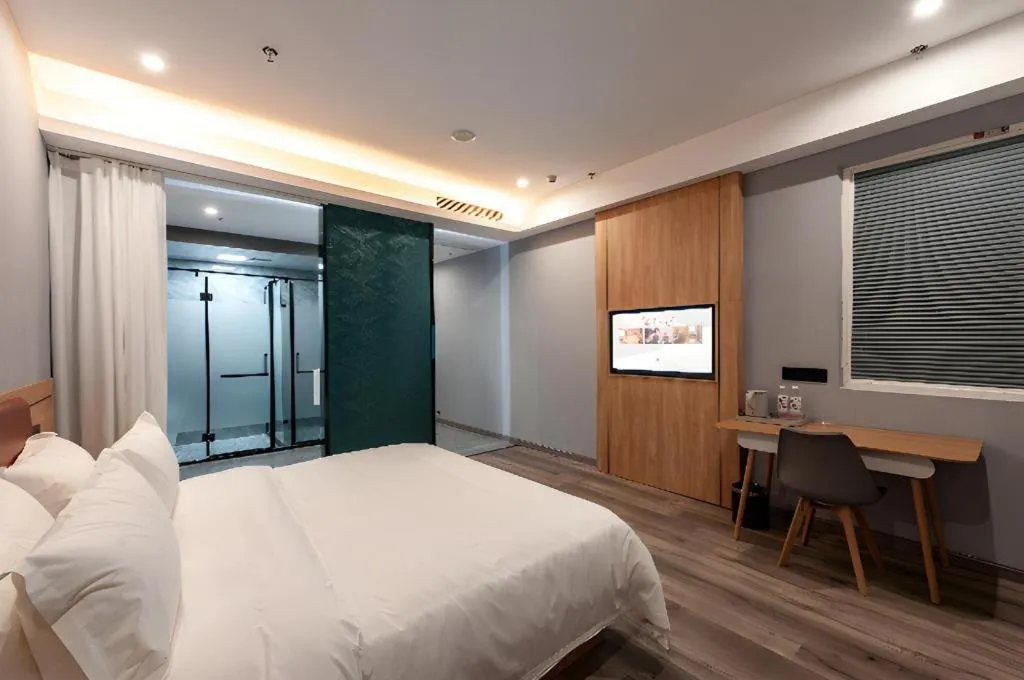 Bed in Borrman Hotel Jiangyin Zhouzhuang