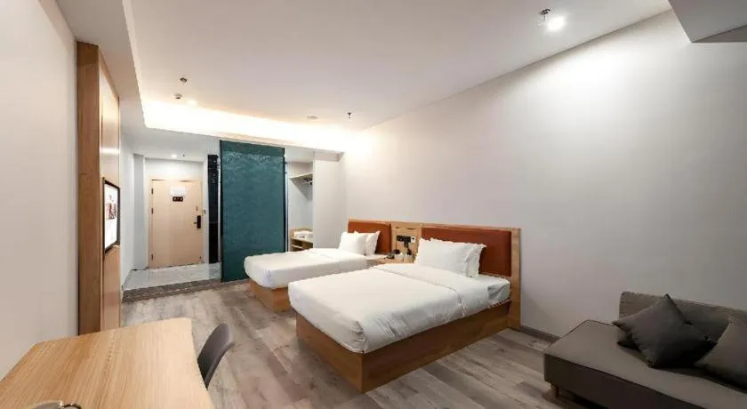 Bed in Borrman Hotel Jiangyin Zhouzhuang