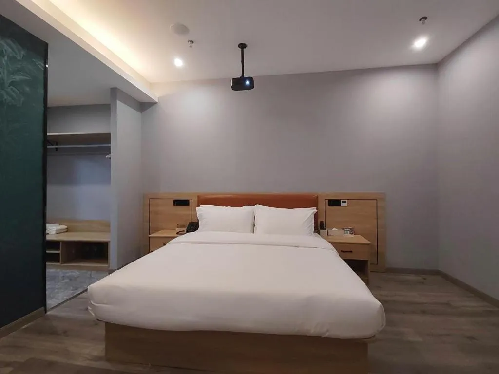 Bed in Borrman Hotel Jiangyin Zhouzhuang